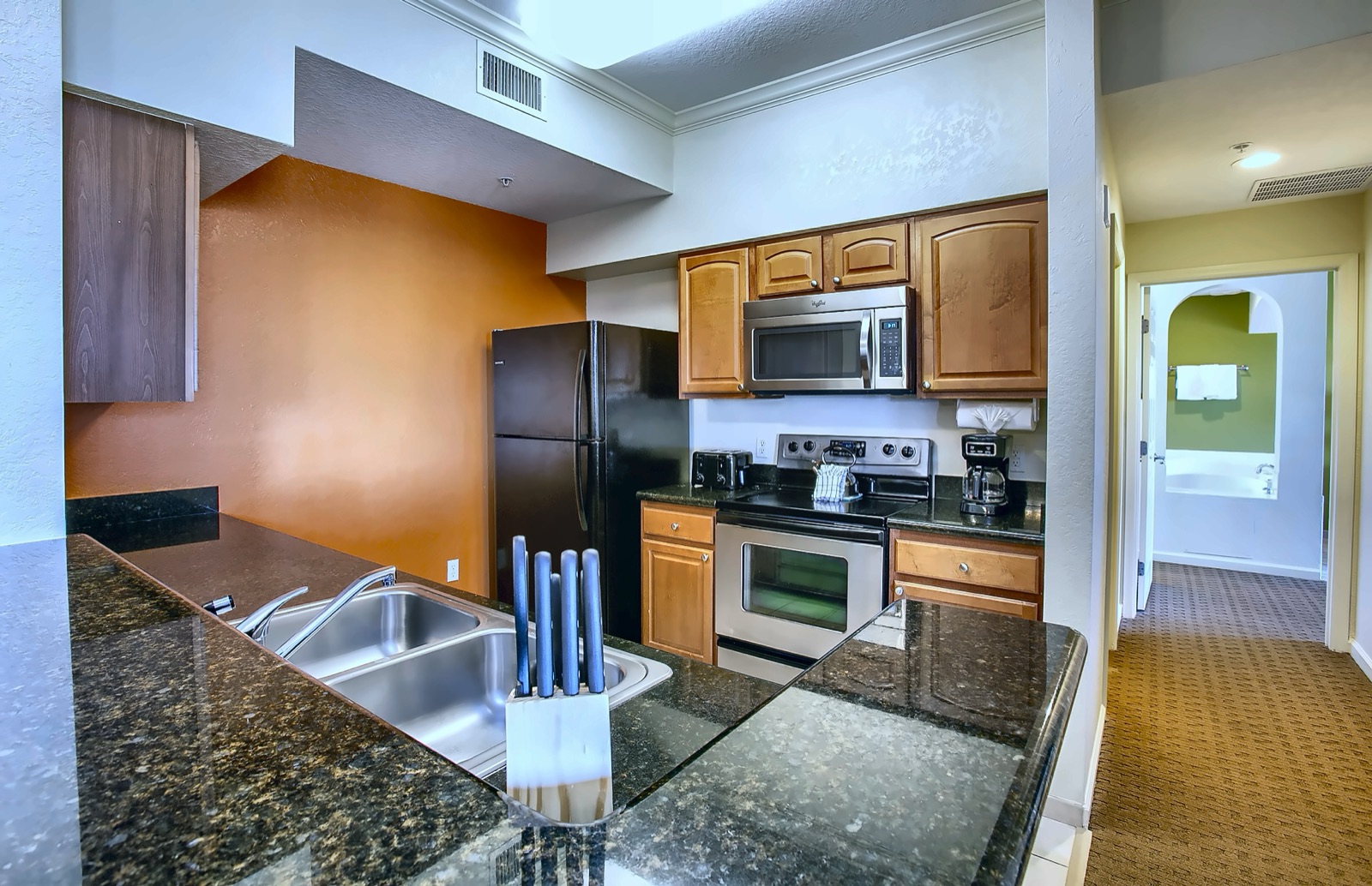 Bright LBV suite bedroom with its own kitchenette area, part of the multi-room suite layout